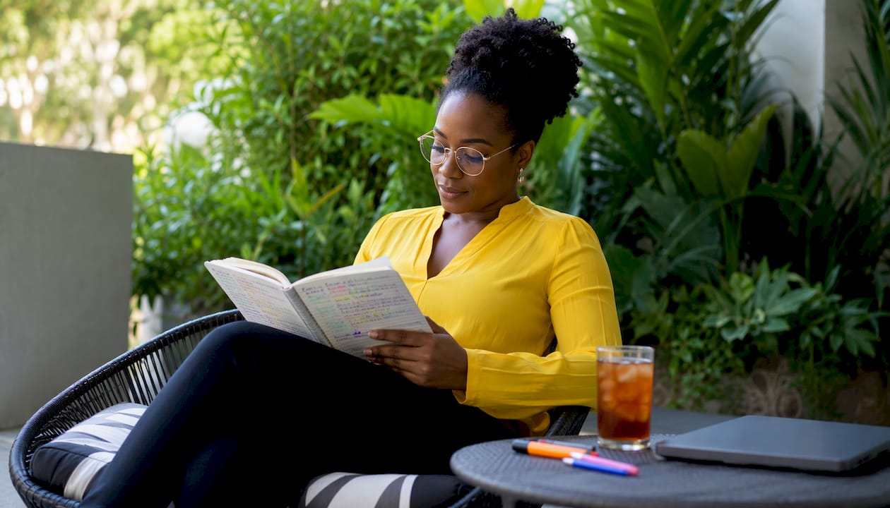 Woman reviewing SaaS product feedback notes