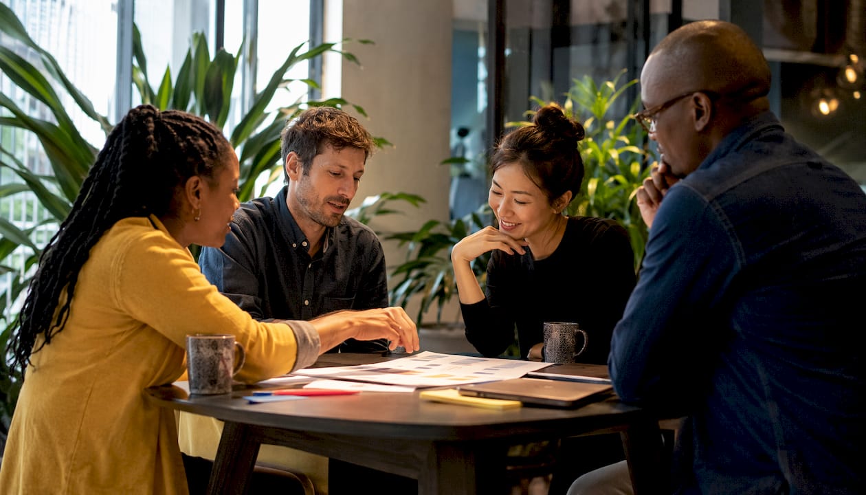 Team discussing SaaS onboarding strategies in office