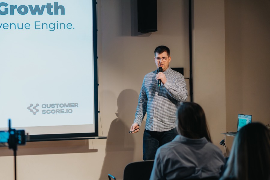 Chatting with attendees at a customer success meetup